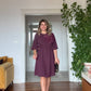 SHORT DRESS WITH LARGE FLORAL DETAIL – DEEP PLUM