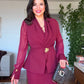DRAPED CROSSOVER NECKLINE MIDI DRESS WITH GOLD-TONE BUCKLE DETAIL AND PEPLUM WAIST - BURGUNDY