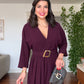 V-NECK BELTED DRESS WITH BUCKLE DETAIL AND ASYMMETRIC DRESS - BURGUNDY