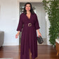 V-NECK BELTED DRESS WITH BUCKLE DETAIL AND ASYMMETRIC DRESS - BURGUNDY