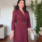 CROSSOVER V-NECK MIDI DRESS WITH PLEAT DETAIL AND BUCKLED BELT - BURGUNDY