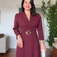 CROSSOVER V-NECK MIDI DRESS WITH PLEAT DETAIL AND BUCKLED BELT - BURGUNDY
