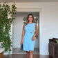 GOLD-BUCKLED SLEEVELESS WRAP MINI DRESS – BABY BLUE