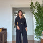 WRAP SUIT WITH GOLD BUCKLE DETAIL – BLACK